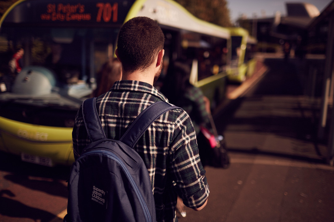 Student getting on campus bus