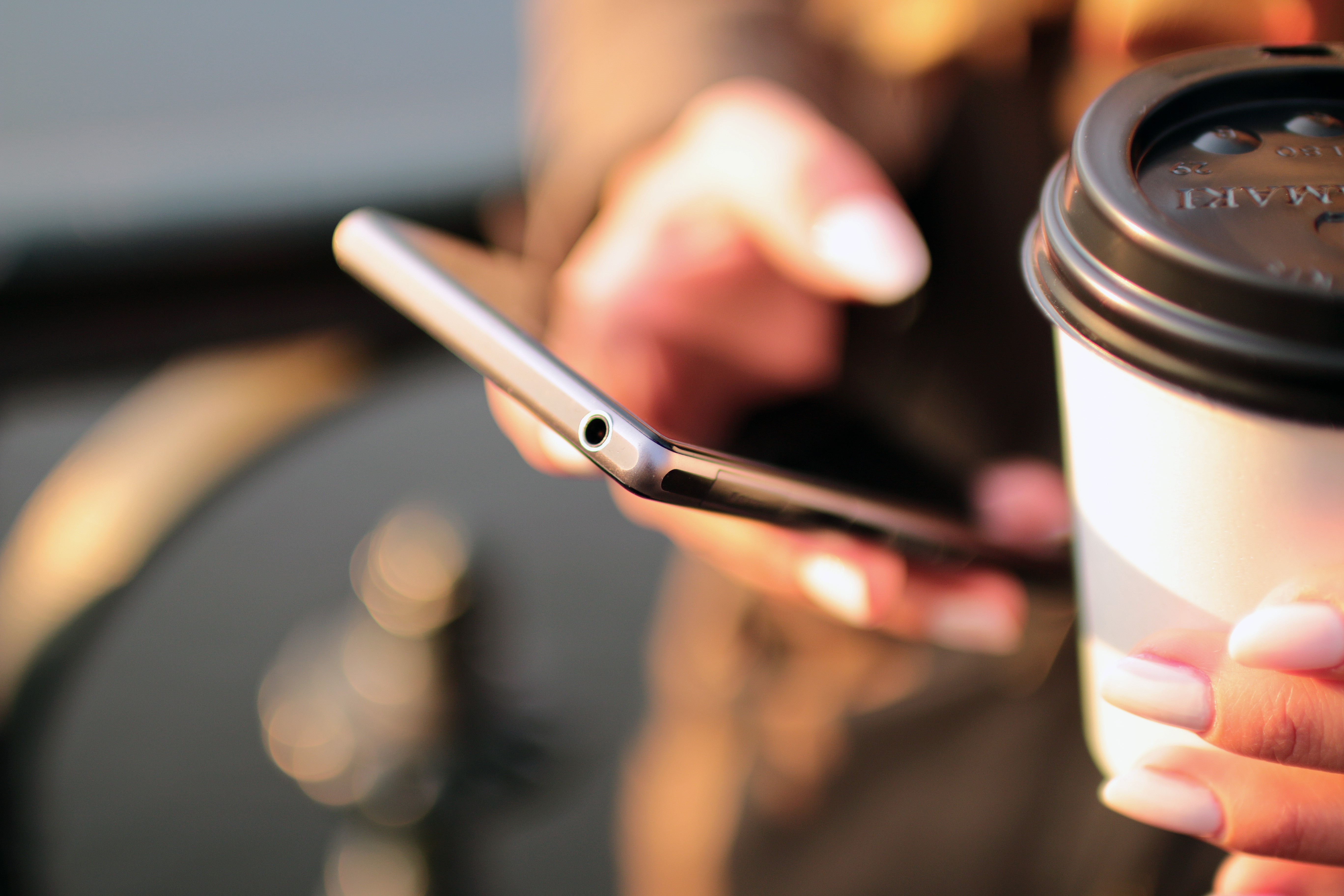 Cup of coffee and mobile phone