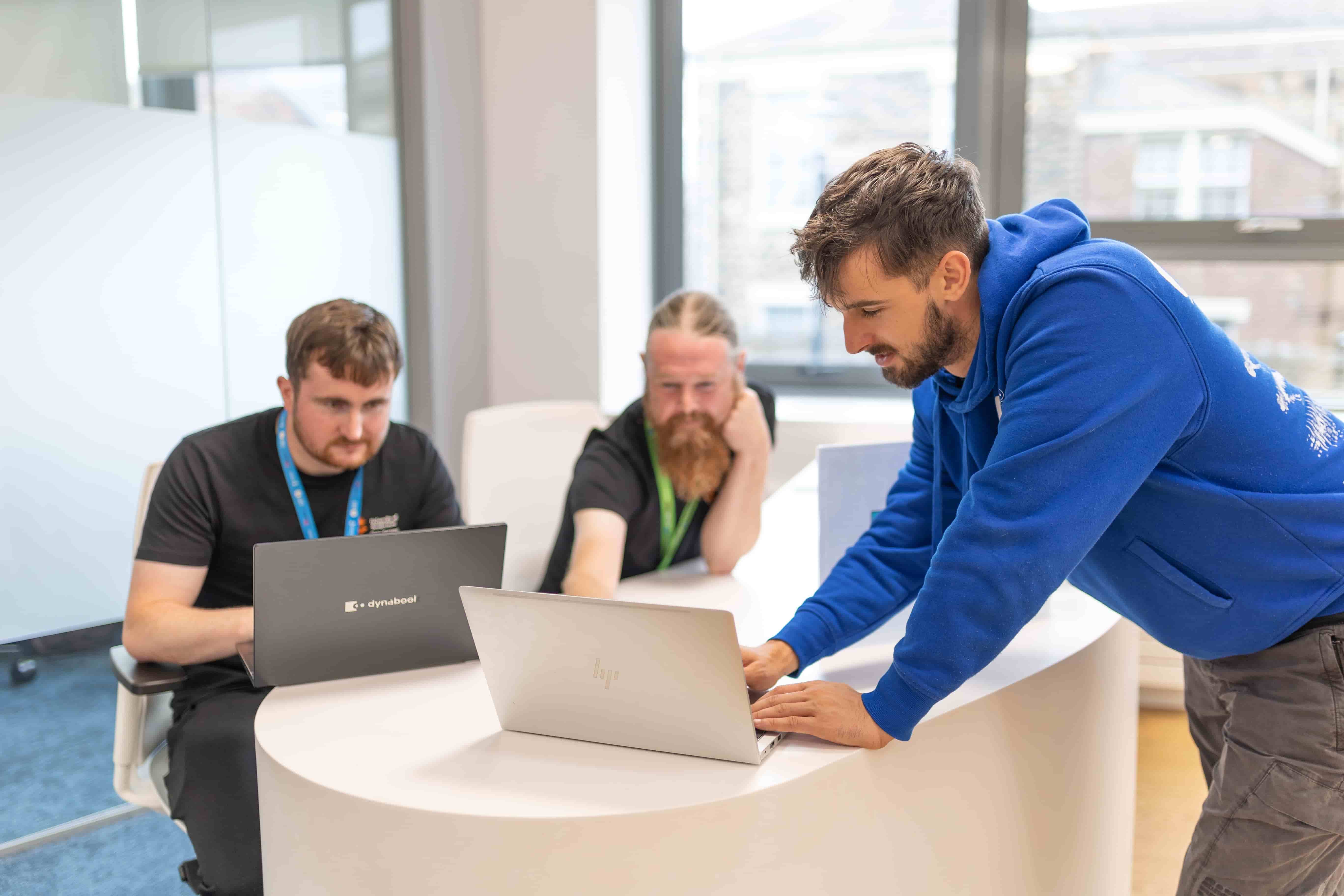 it staff working on laptops